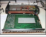 Roland TR-808 - Cover Opened * Cover opened. The steel plate shields the audio electronics from PSU interferences.