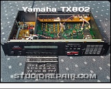 Yamaha TX802 - Opened * Top cover removed. Two pull-out cards; an operational guide and a reference card for FM synthesis. RAM4GF Cartridge in place.